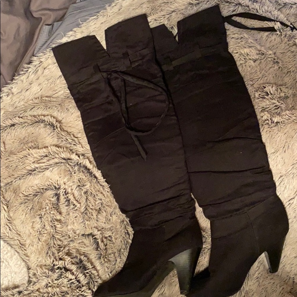 Thigh high black boots